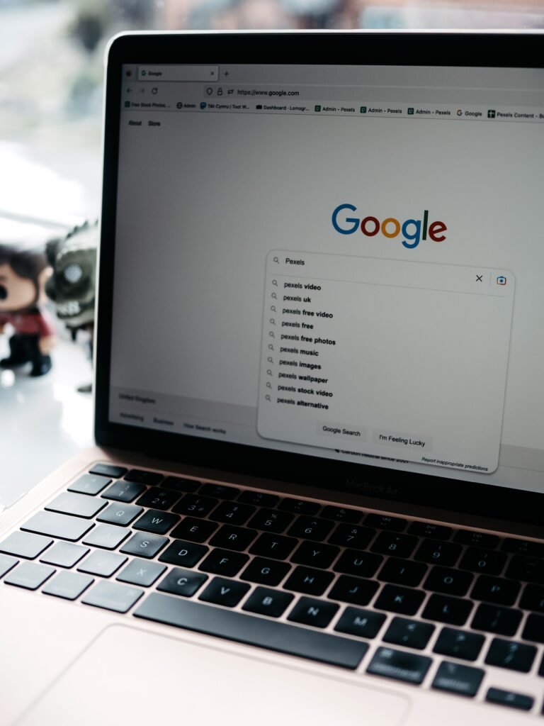 Laptop screen showing a Google search results page with related searches