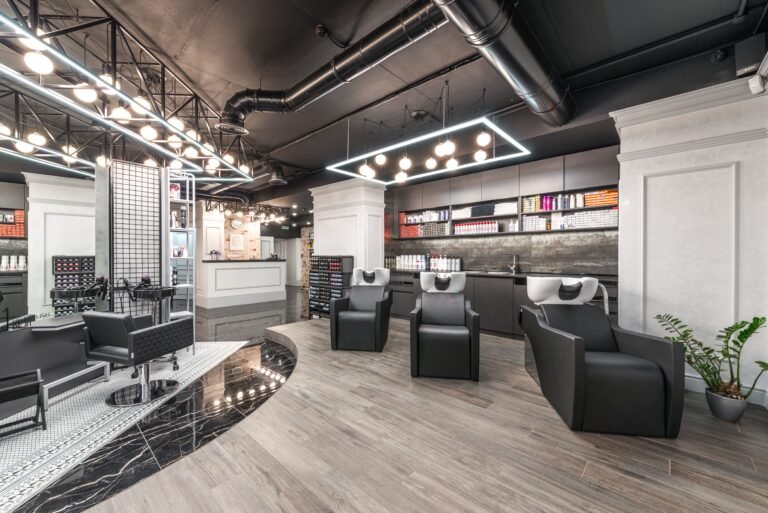 Modern beauty salon interior with styling chairs and sinks